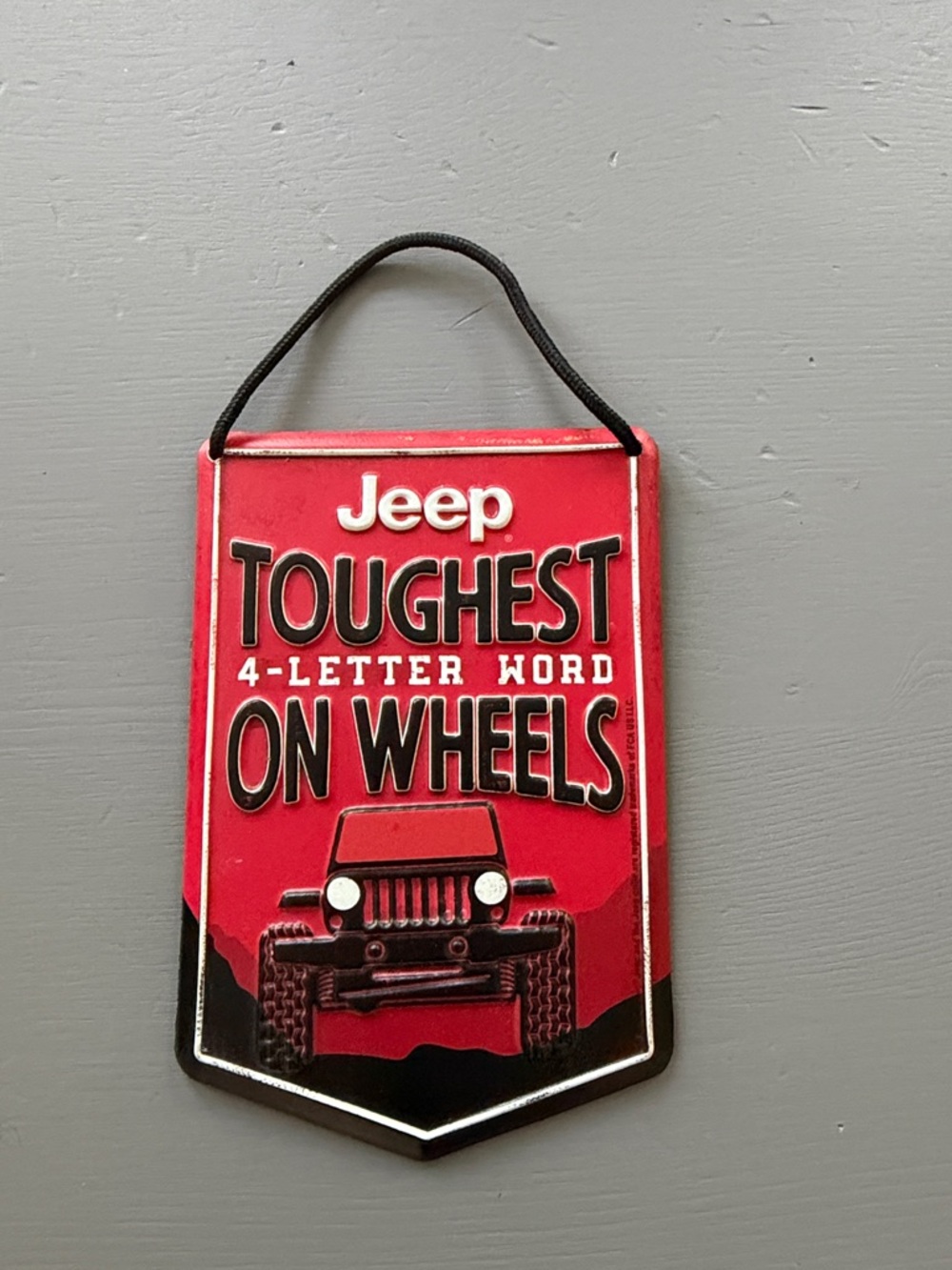 Jeep Red Toughest 4-Letter Word On Wheels Metal Wall Sign